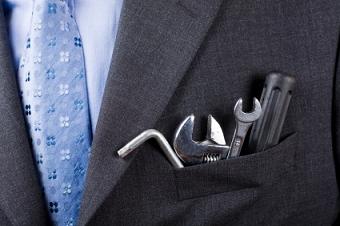 Business man well-dressed with tool kit
