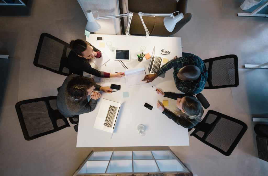 Multi-ethnic business people discussing in board room meeting Multi-ethnic business people discussing in board room meeting