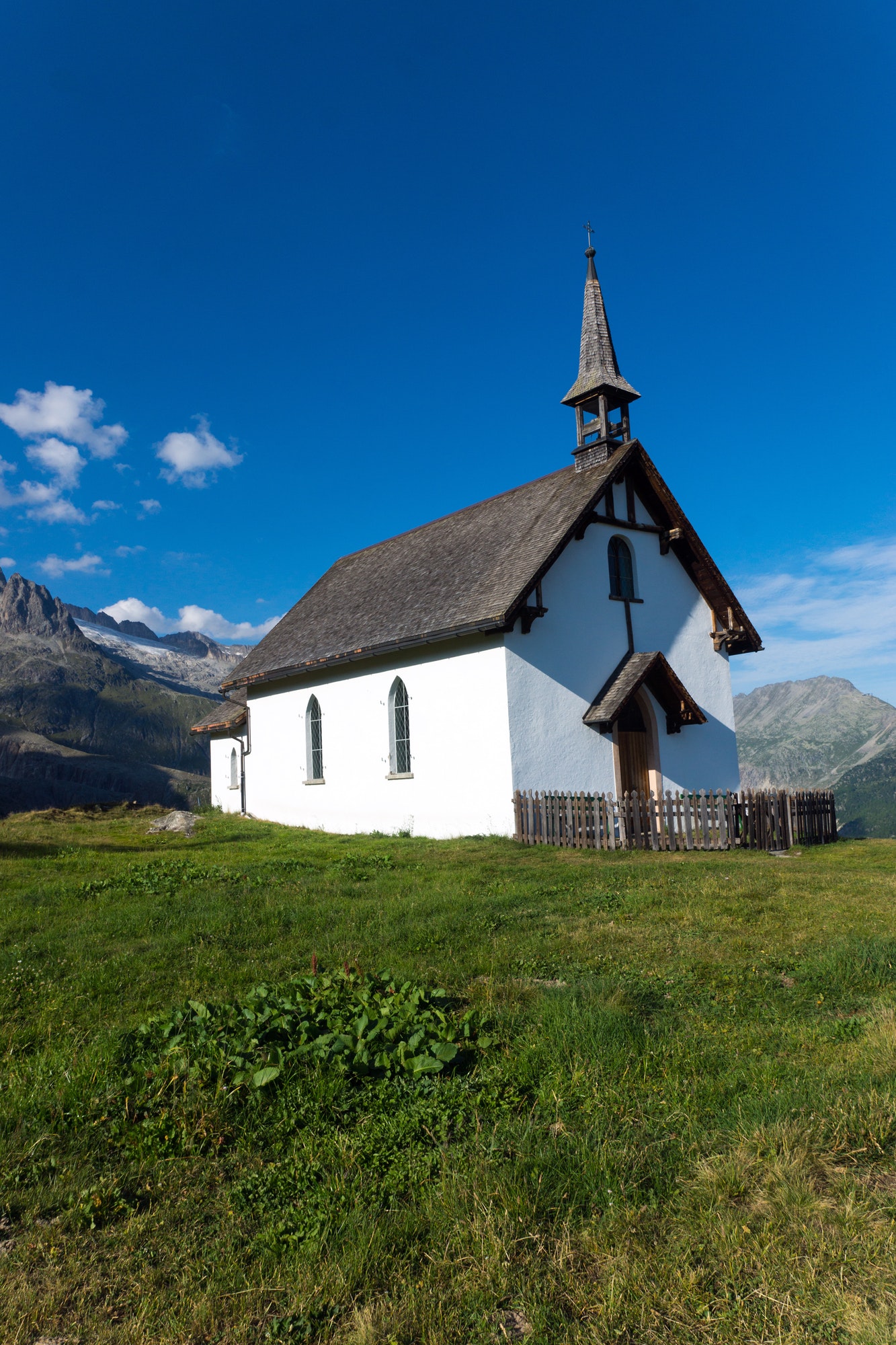Small white church in the alps Small white church in the alps