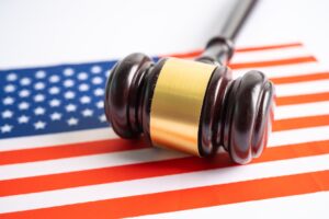 USA America flag with gavel for judge lawyer. Law and justice court concept.